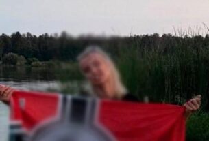 Новини Києва - У Києві секретарка суду позувала з нацистським прапором